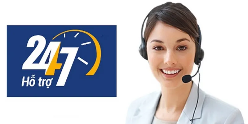 Image showing a blue “24/7 Hỗ trợ” logo featuring a yellow clock arc next to a professional customer service representative in a light blazer wearing a headset, on a clean white background — 24/7 support, Hỗ trợ, customer service, hotline, Vietnamese support